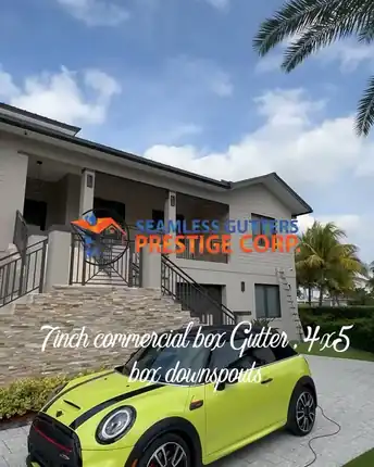 A two storey South Florida home fitted with a 7 inch commercial box gutter and 4 by 5 box downspouts